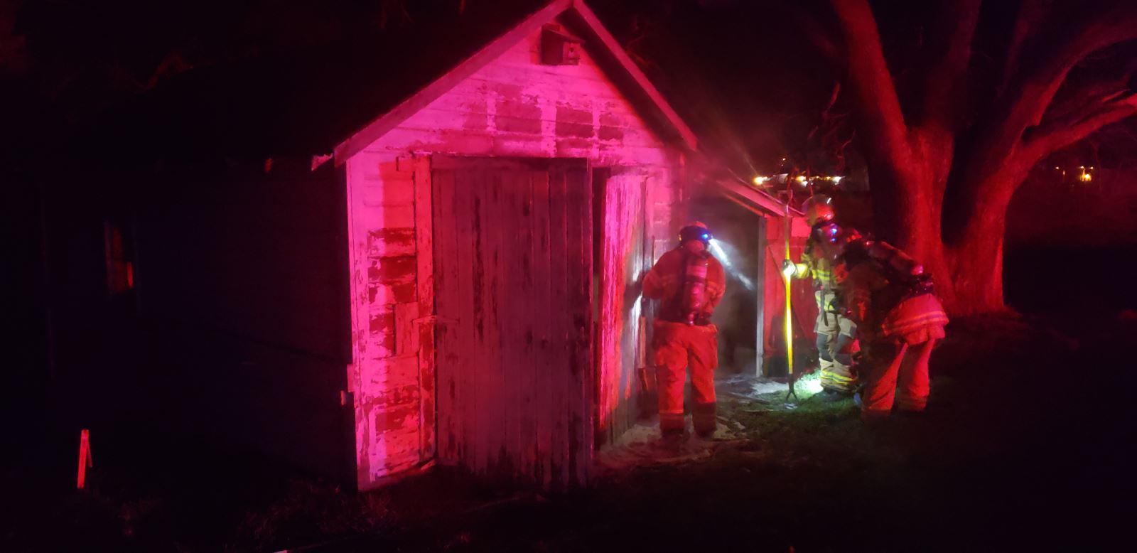 Firefighters extinguish a barn fire